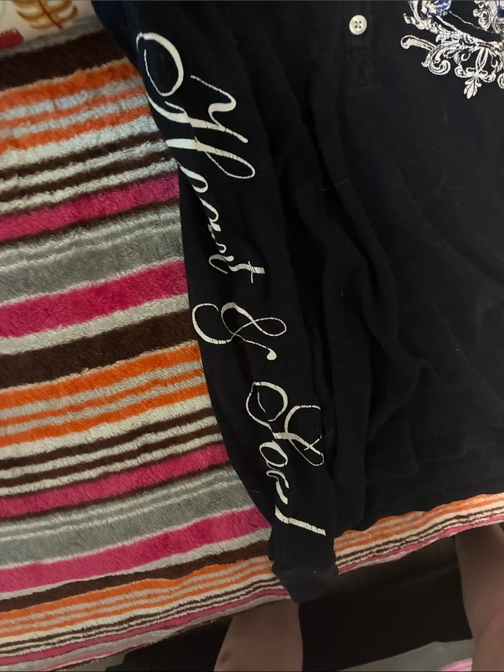 Black Hooded Women's Sweater with Blue Embellished Crest and words on sleeves